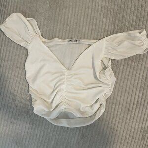 White ruffled top with short sleeves